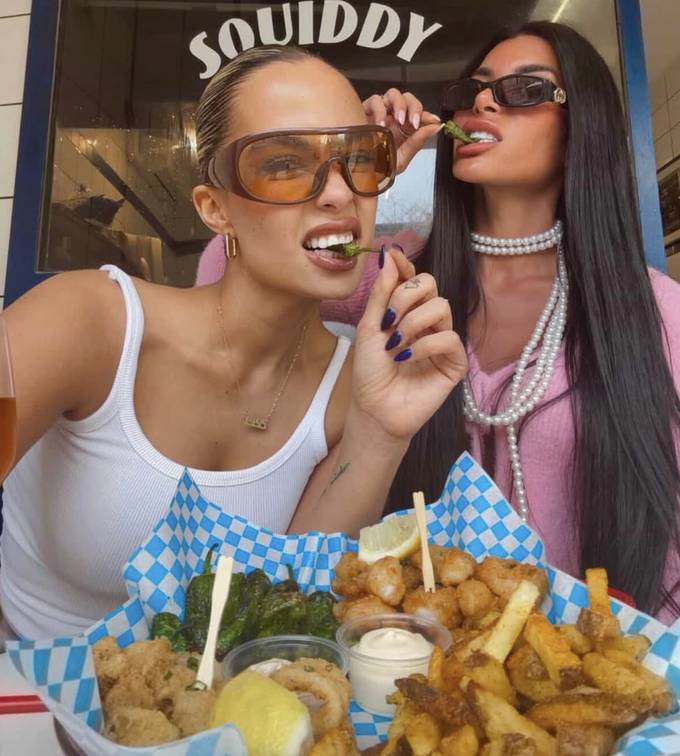 Friends sharing a Squiddy platter